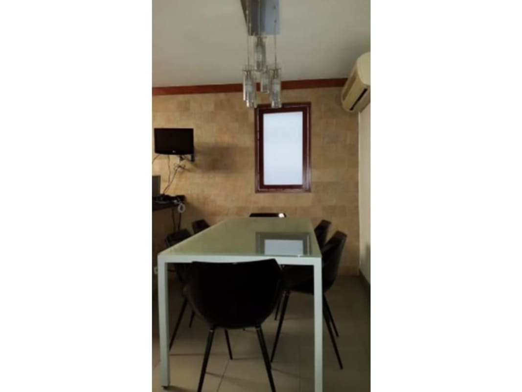 Master bedroom with large bed and balcony door in duplex Obarrio Panama