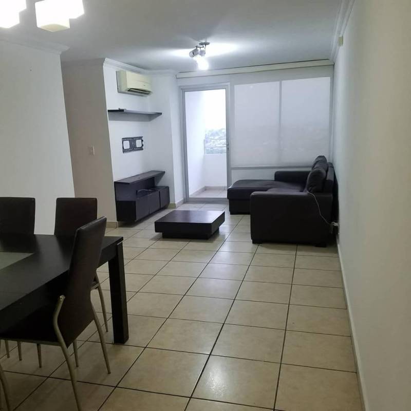 Closed kitchen with granite countertops and adjacent laundry in PH Victoria Hills