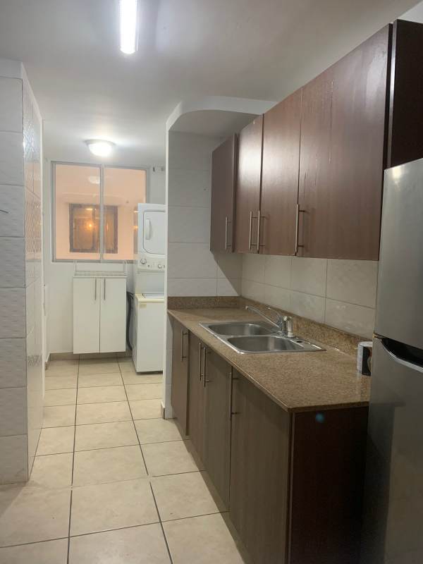 Bedroom featuring built-in wardrobe and view over city skyline Victoria Hills apartment