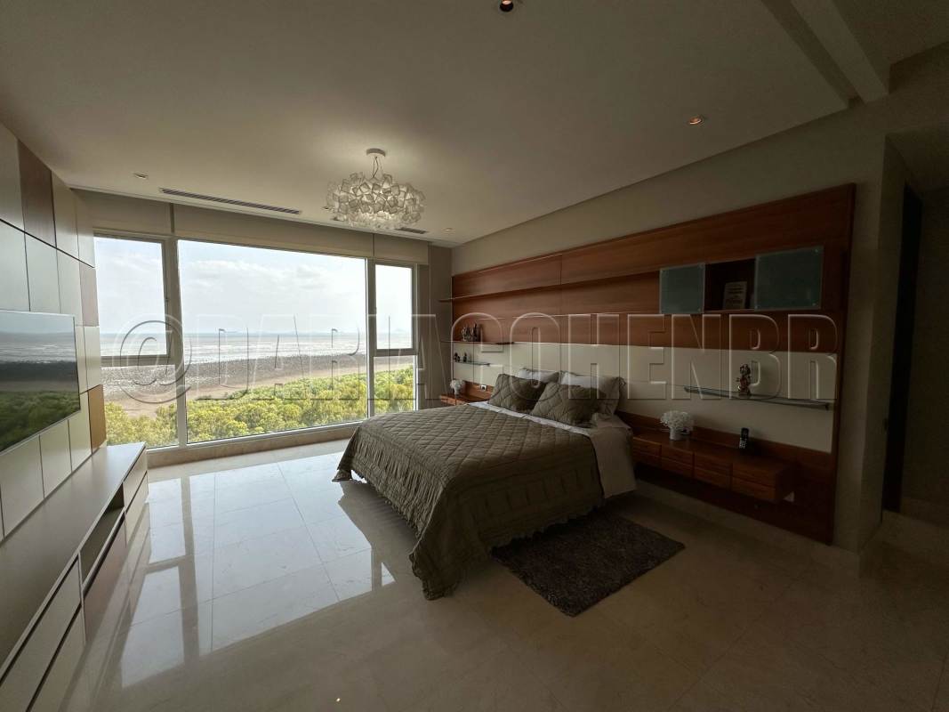 Ocean view master suite with marble floors and balcony at PH Marea Panama