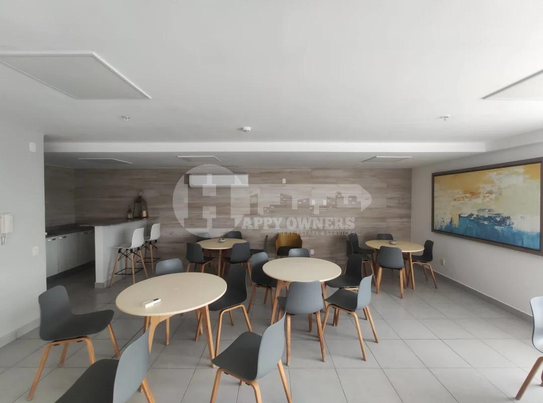 Apartment kitchen with gray cabinets granite counter sliding glass door PH Solok Parque Lefevre Panama