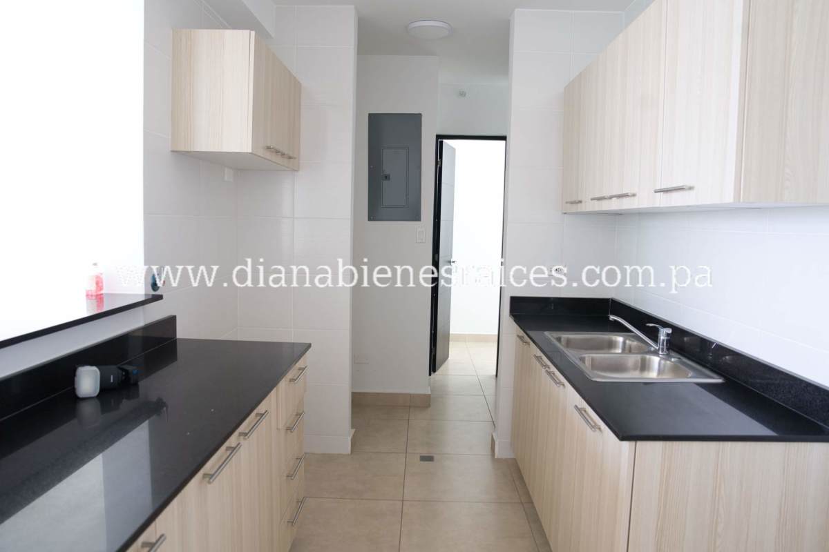 Open kitchen design with granite countertop light wood cabinetry in PH Altamira Hato Pintado Panama City