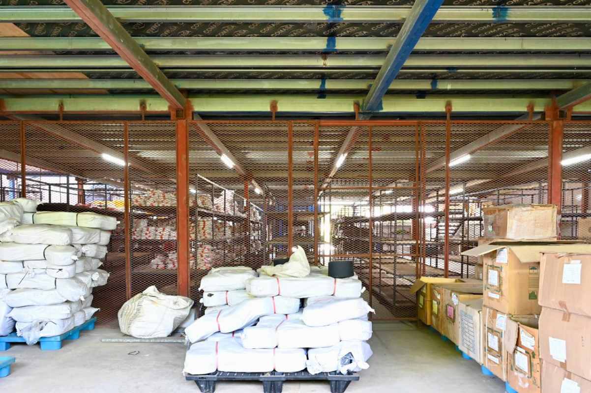 Warehouse interior with metal mesh partitions and shelving Panama