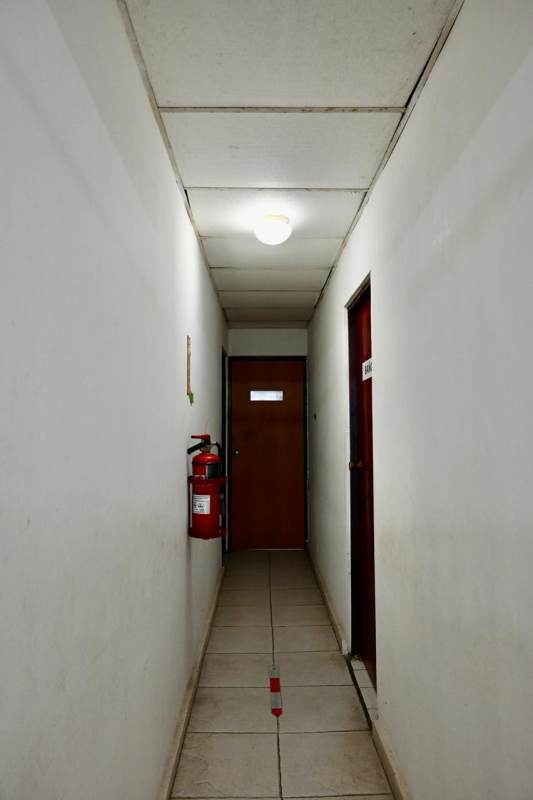 Hallway access to offices inside industrial warehouse complex Panama City