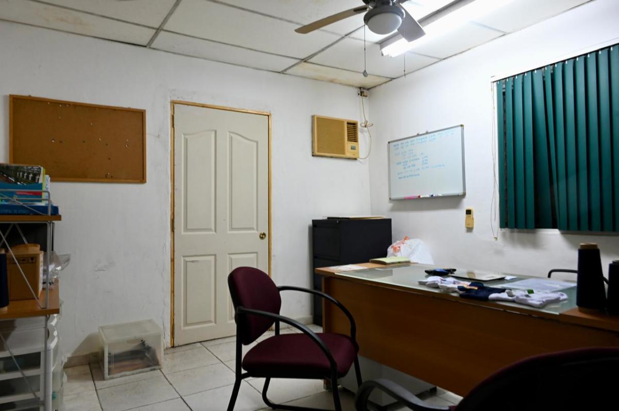 Simple office space with partition walls and blinds inside commercial building Panama