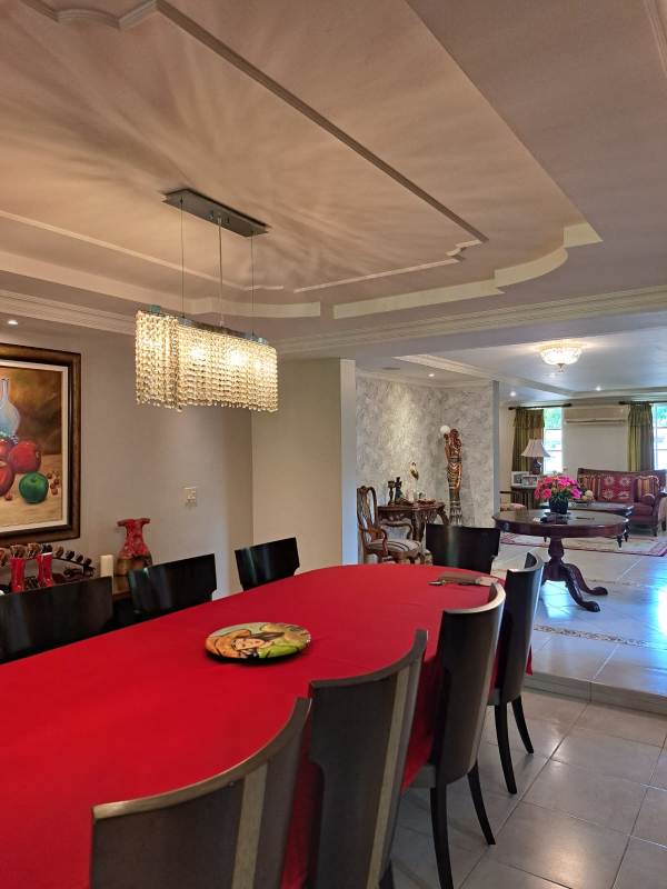 Classic kitchen with wooden cabinets, granite countertops, all appliances in Cardenas Village Clayton home