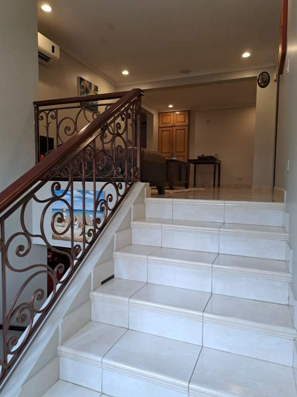 Bedroom with desk, large bed, garden view window, Cardenas Village Clayton Panama rental