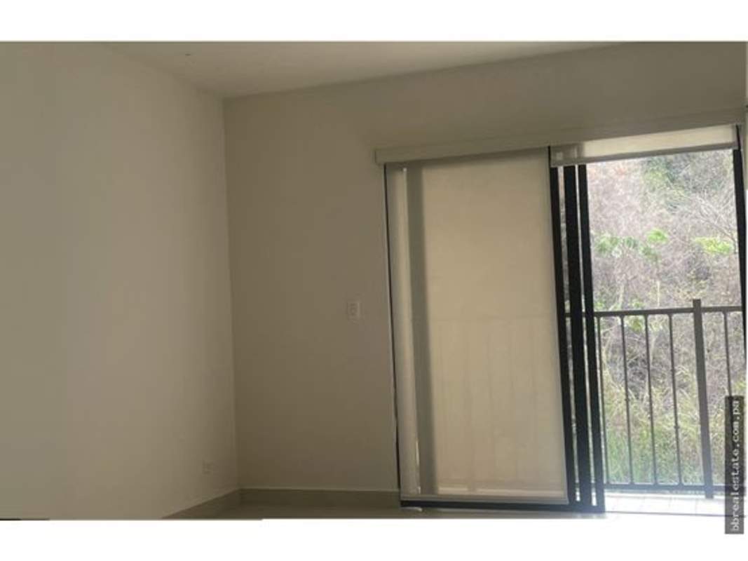 Swimming pool area with sun loungers, contemporary condo buildings PH Embassy Village Clayton Panama