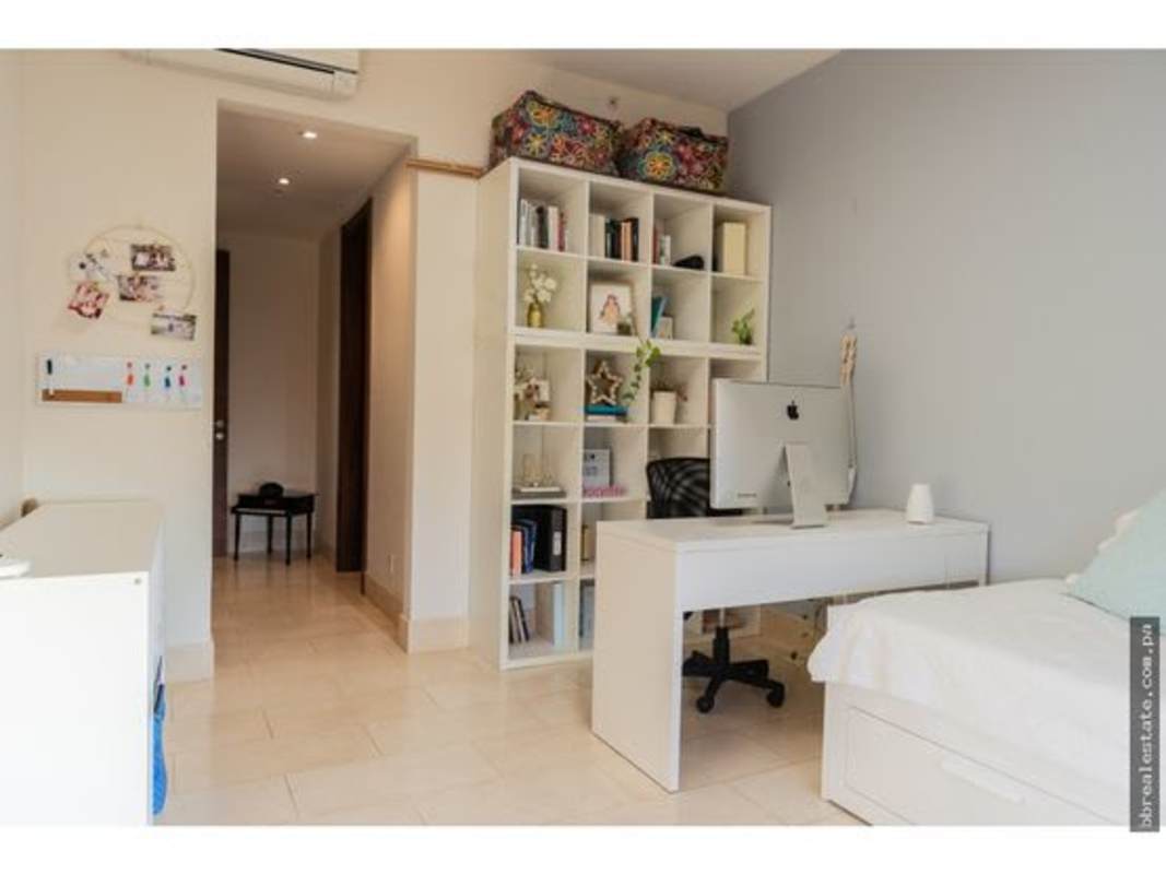 Bedroom with workspace, shelving, AC, natural light at PH Greenview Panama