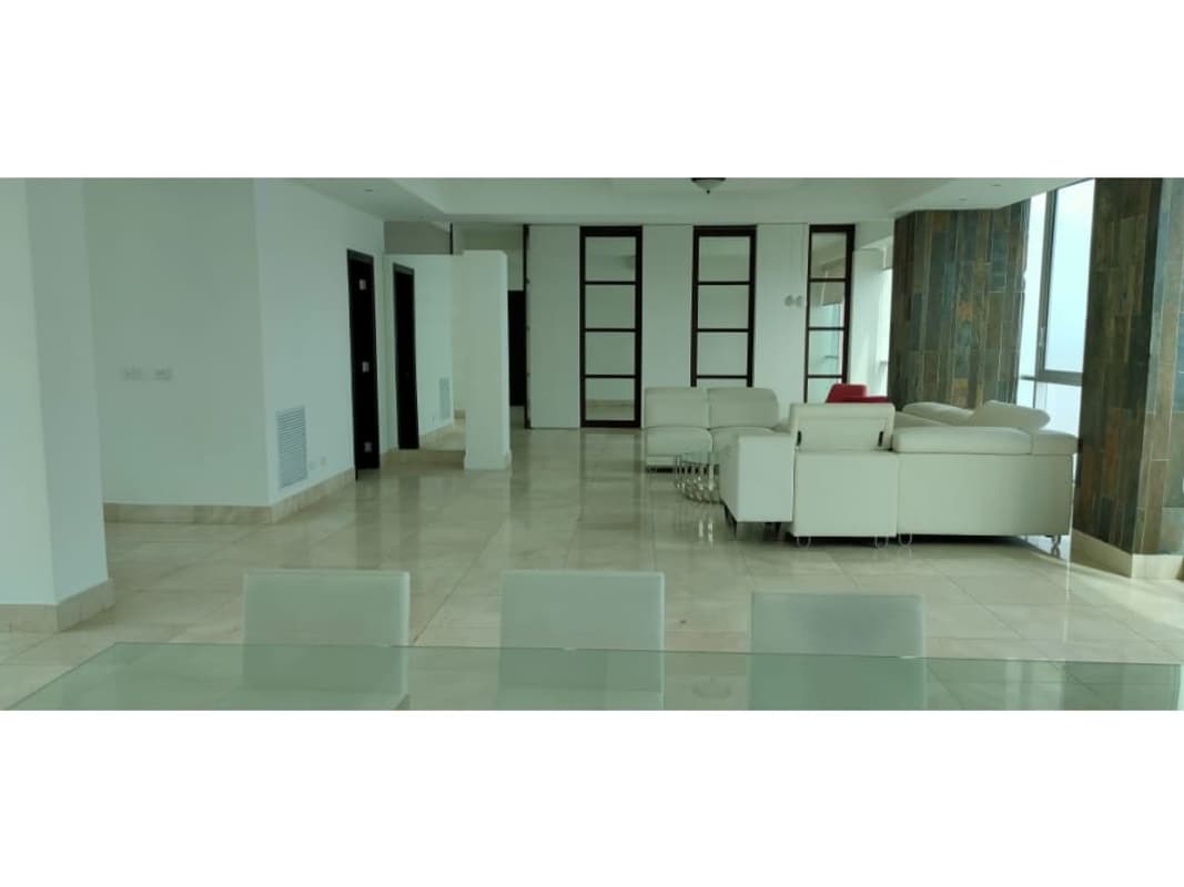 Spacious living dining area with large windows and neutral decor Ocean Two Panama