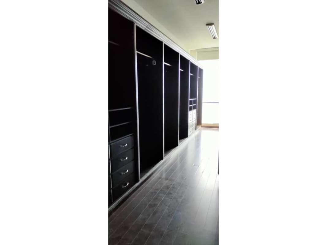 Modern spacious closet dark cabinetry storage Ocean Two Tower Panama
