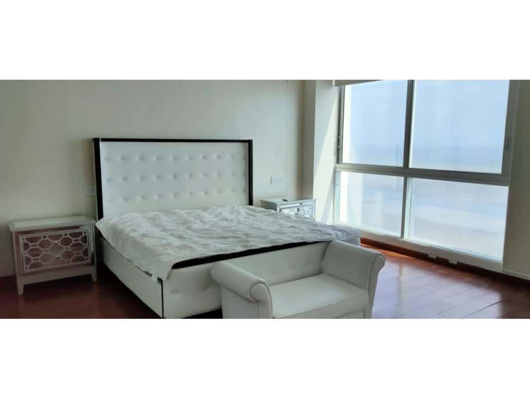 Luxurious bedroom with floor-to-ceiling windows, ocean views at Ocean Two Panama