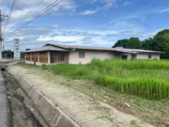 Sidewalk and single-story commercial building with highway frontage Puerto Armuelles Chiriquí