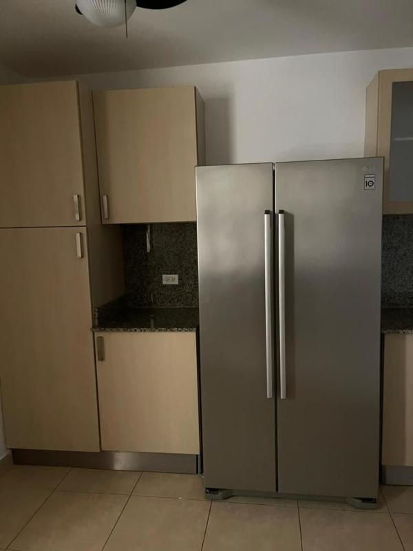 Master bedroom with ocean view windows at PH Parque del Mar Costa del Este Panama