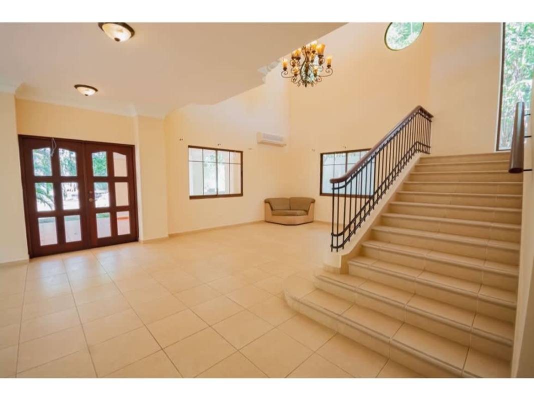 Classic Mediterranean style two-story home with terrace and lush landscaping in Clayton Panama City