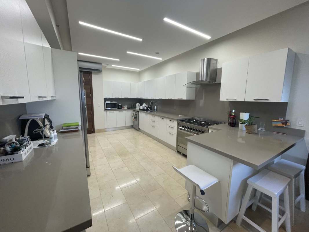 Comfortable family lounge area with marble floors at PH Greenview Panama City