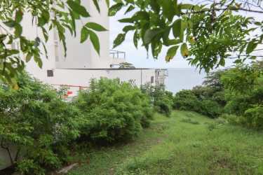 Vacant coastal development land with ocean view and natural landscape