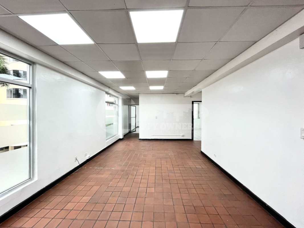 Large office interior with tiled floor and window light in San Francisco Panama