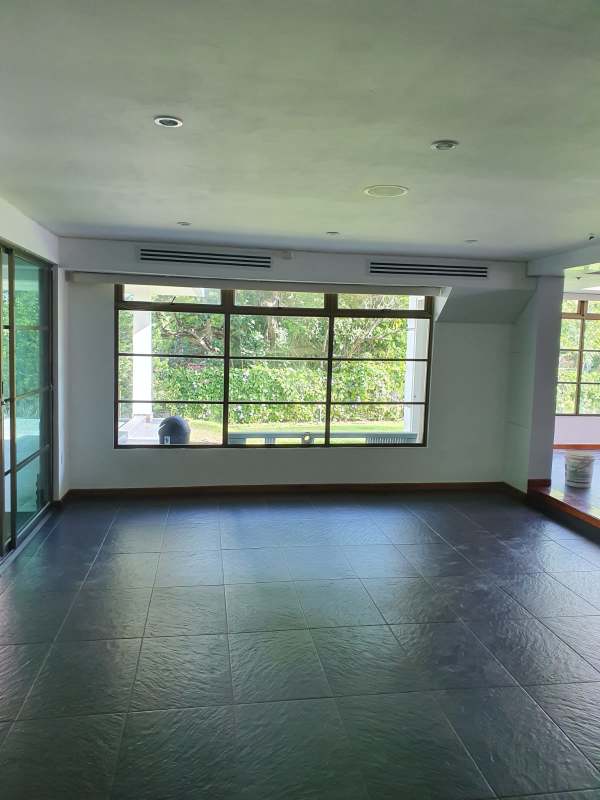 Bright spacious living room modern design with large windows in Clayton Cardenas Panama