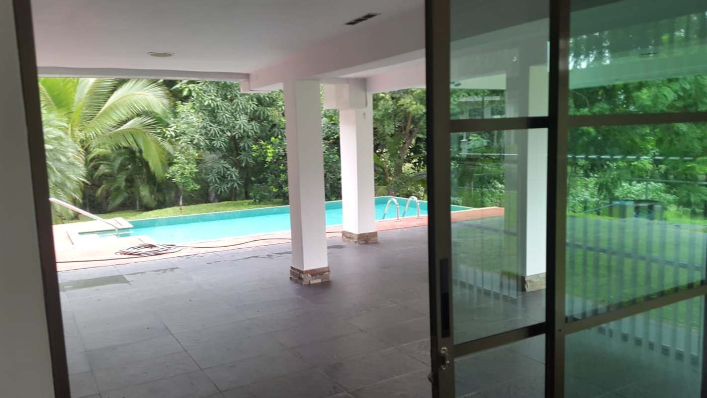 Private swimming pool with lush gardens in luxury Cardenas house Clayton Panama