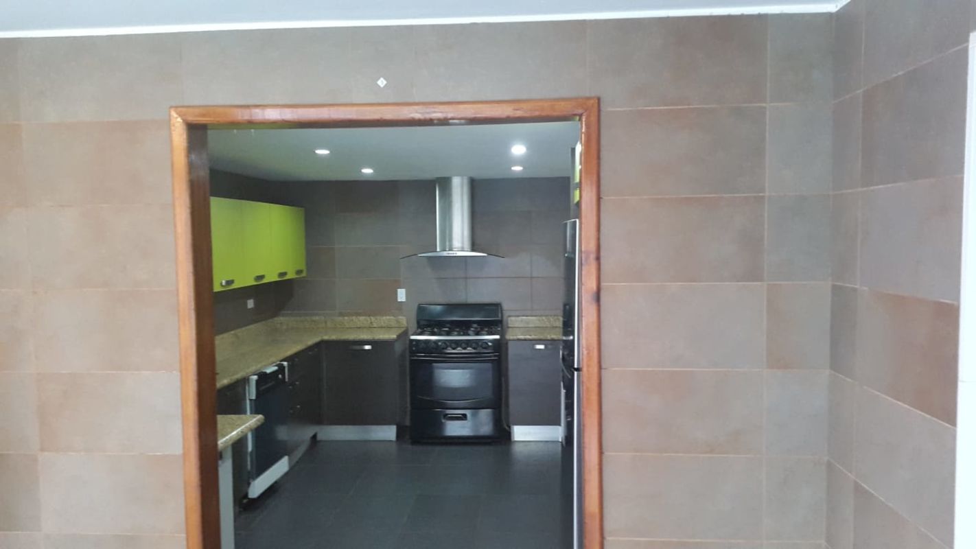 Wooden staircase contemporary design leading to lower floor luxury home Cardenas Panama