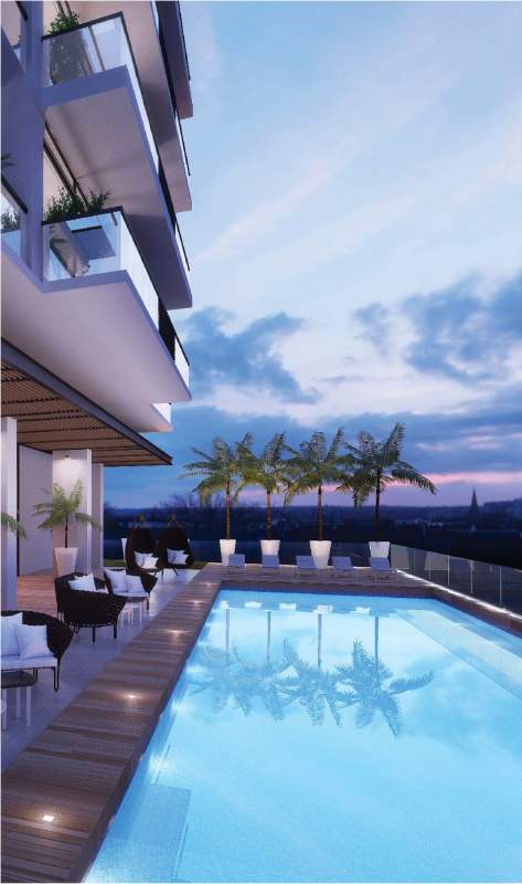 Rooftop swimming pool with panoramic cityscape views at Nogal Costa del Este