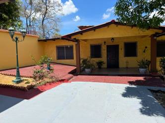 Private full tennis court surrounded by greenery at El Celaje estate Chame Panama