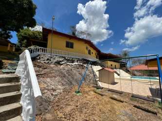 Large swimming pool with sundeck, jacuzzi, gazebo and gardens in country estate near Chame Panama