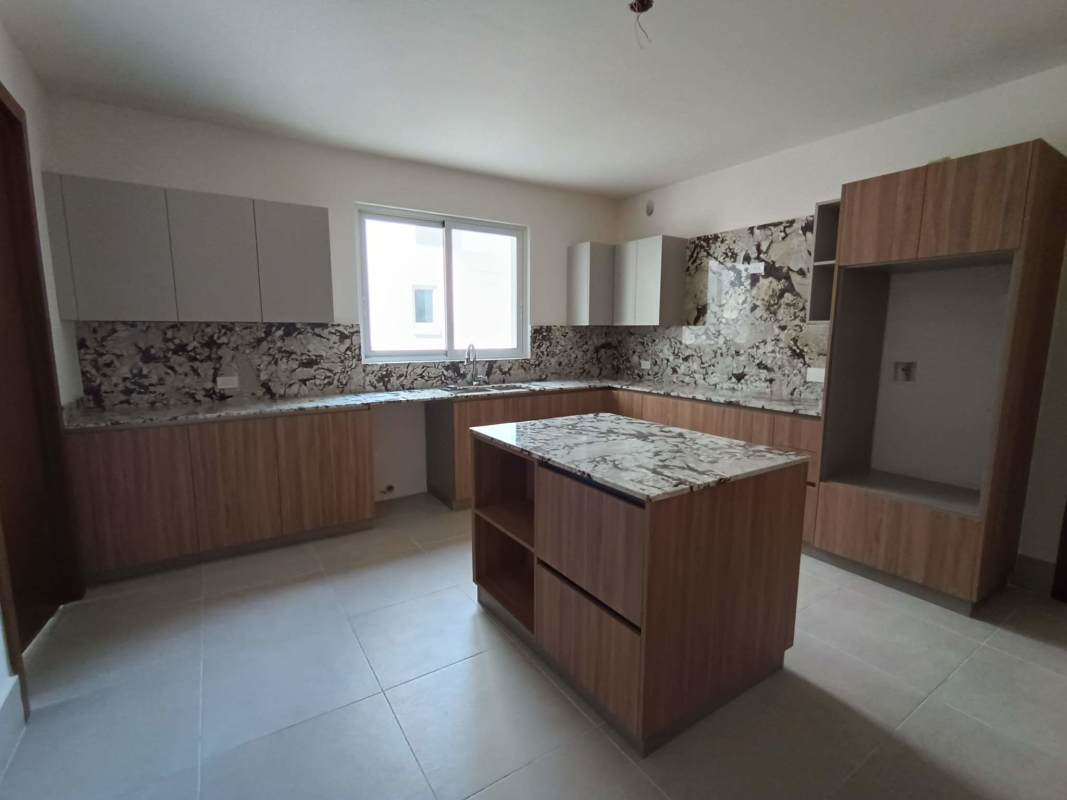 Modern luxury bathroom with double vanity marble top and glass shower in The Reserve Panama
