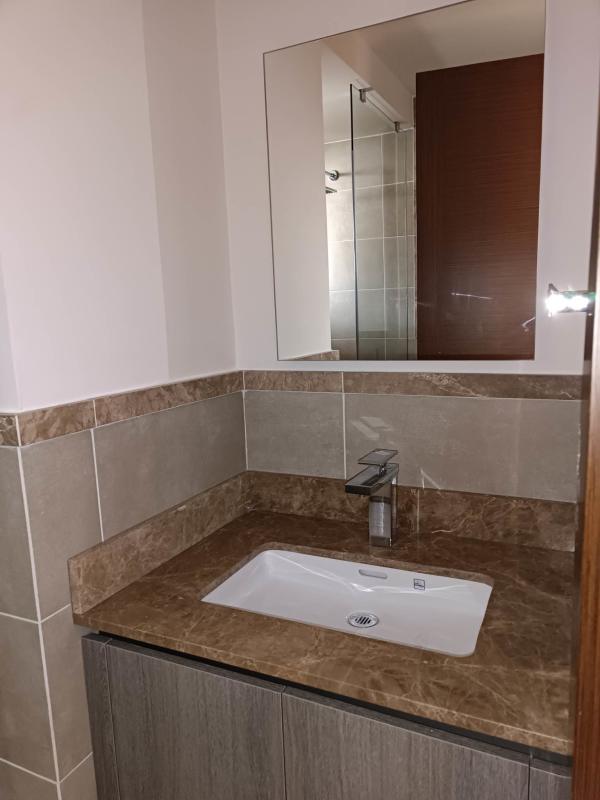 Luxury modern kitchen with marble countertops and island in Santa Maria Panama apartment