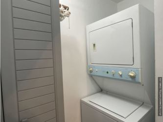 Lagoon pool surrounded by palm trees at Waterways Playa Blanca Resort