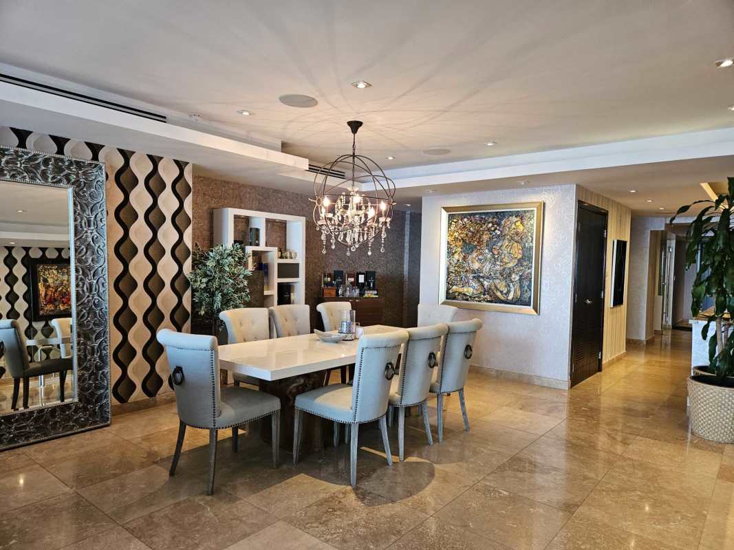 Luxury dining area chandelier accent wall marble floors PH Rivage Tower Panama