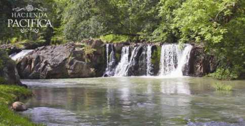 Private waterfall surrounded by greenery within Hacienda Pacifica Panama Oeste
