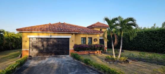 Large tropical backyard with covered terrace and greenery Hacienda Pacifica Panama