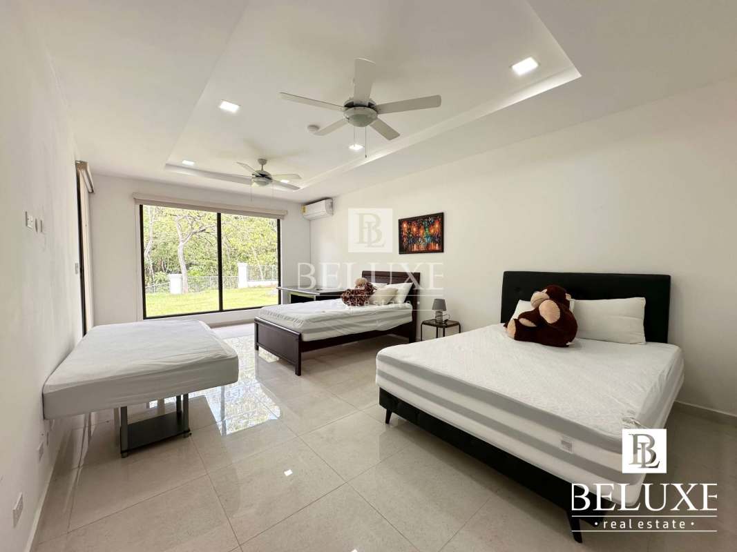 Bright bedroom with large windows, walk-in closet, Cerro Azul Panama house