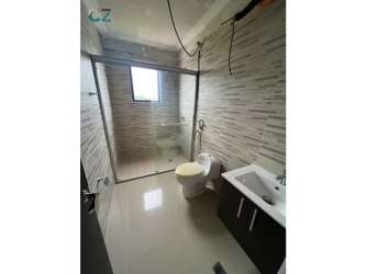 Spacious bathroom with glass shower and modern fixtures Vista Mar Beach Resort