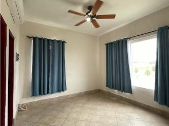 Renovated kitchen with blue cream cabinetry, quartz countertops in Vista Mar PH Roca Marina Panama