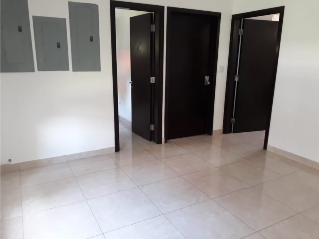 Modern bathroom with double vessel sinks, large mirrors, beige tile in luxury Clayton home