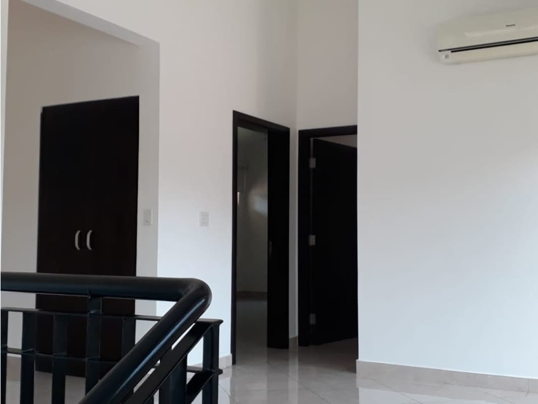 Spacious kitchen with granite countertops, island, stainless appliances in Panama luxury house