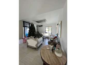 Bright living area with high ceiling, windows, open layout PH Nativa Panama Pacifico