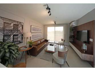 Open kitchen with granite counters and stainless appliances in apartment for rent PH Madeira