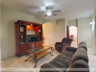 Large garden lawn covered patio trees fenced yard Santa Clara Coclé Beach House Panama