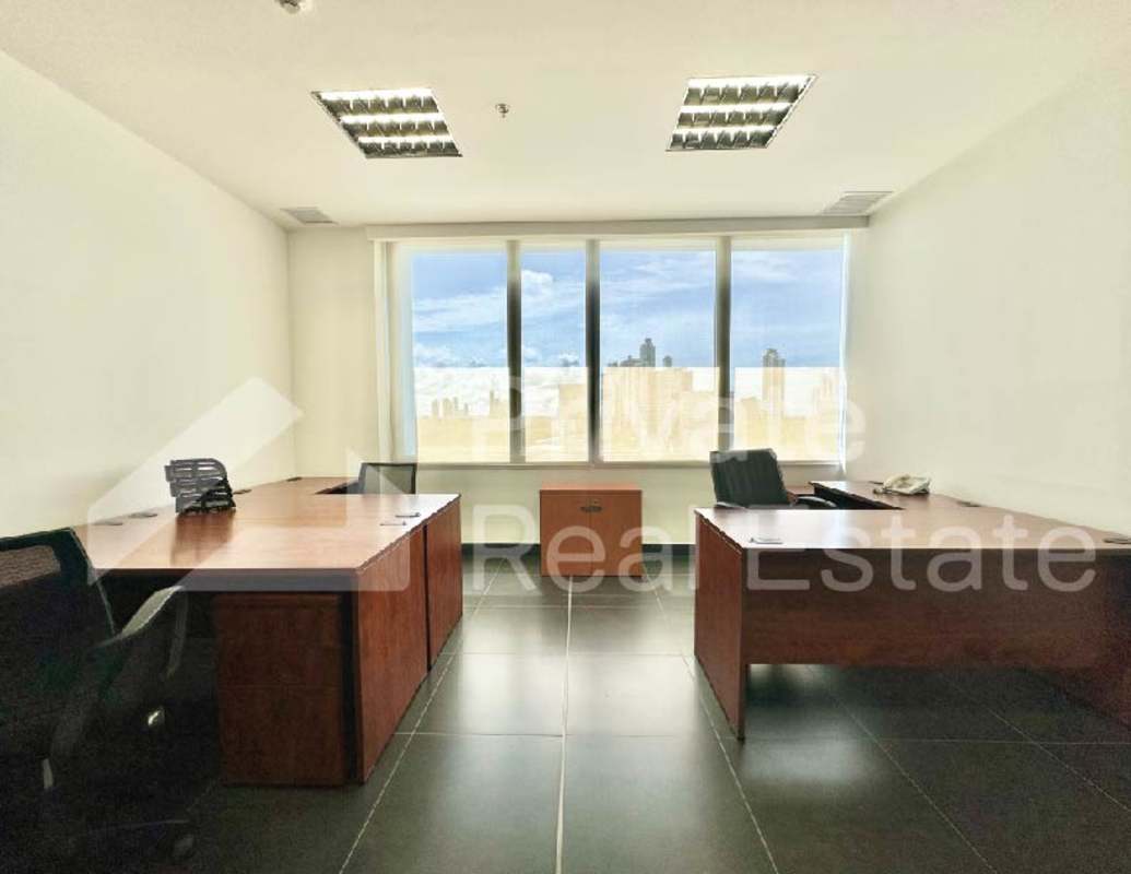 Glass-walled conference room with modern furnishings in Torre Centenario Panama