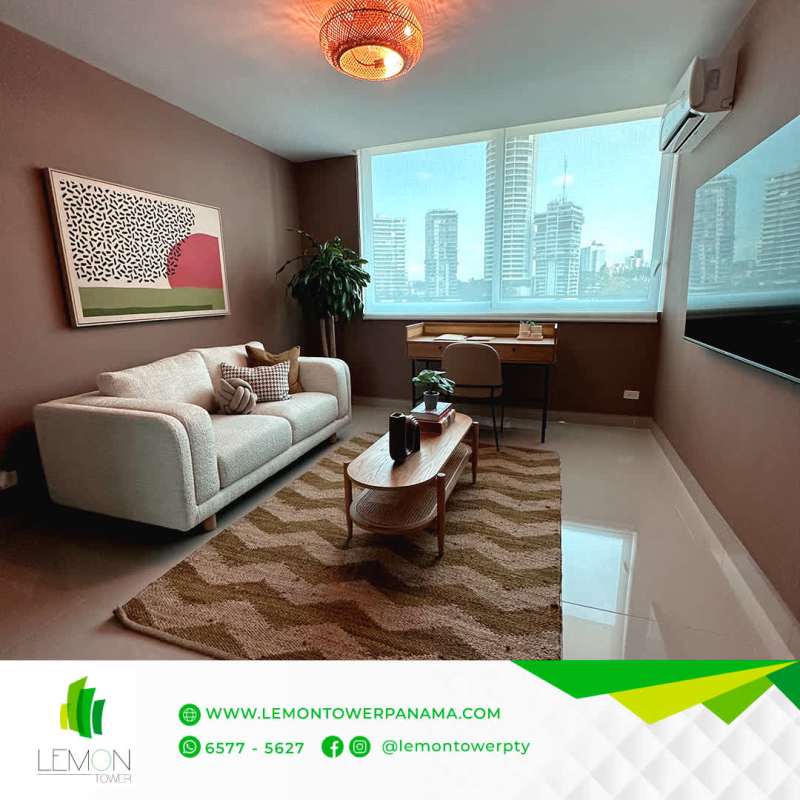 Open living room with sofa, large window and balcony in PH Lemon Tower Bella Vista Panama City
