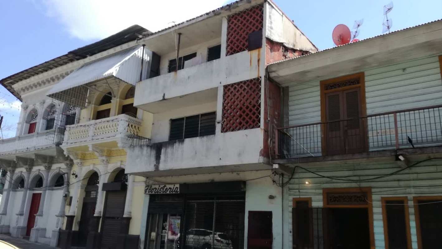 Colonial style facade with balconies and commercial storefronts Casco Viejo Panama