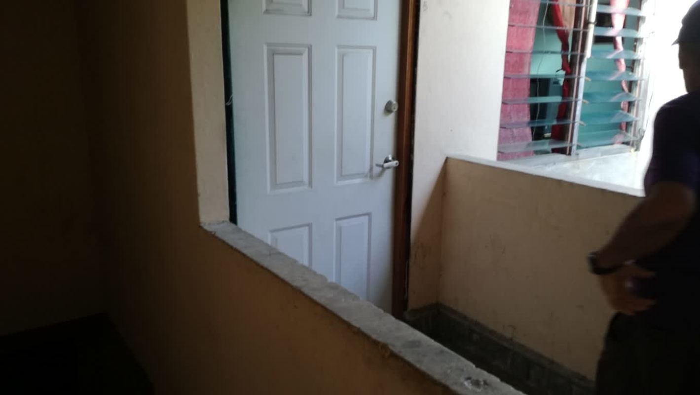 Weathered balcony with jalousie window and decorative railing in colonial building Casco Viejo