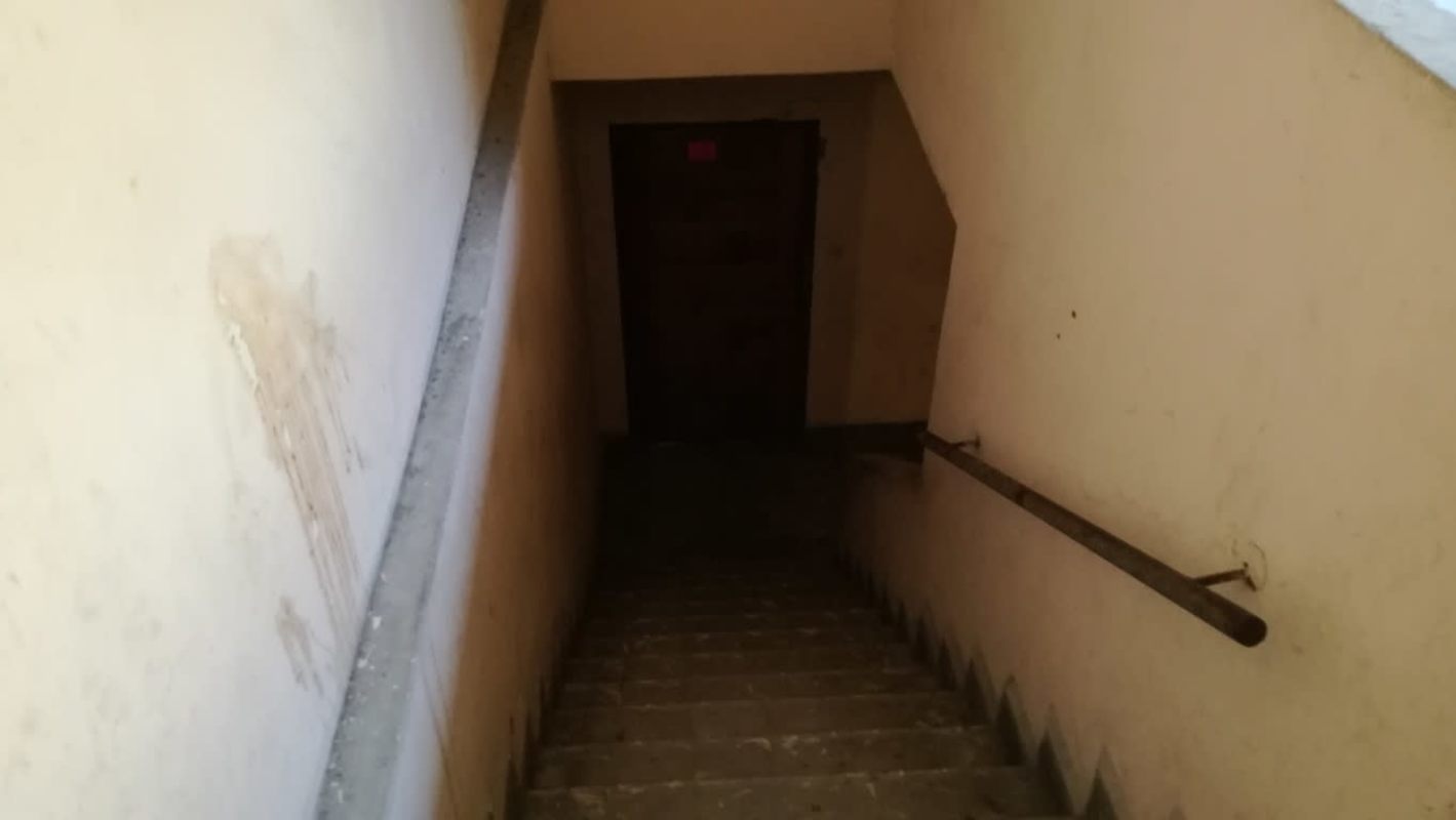Interior stairwell leading to basement area in colonial era Casco Viejo building