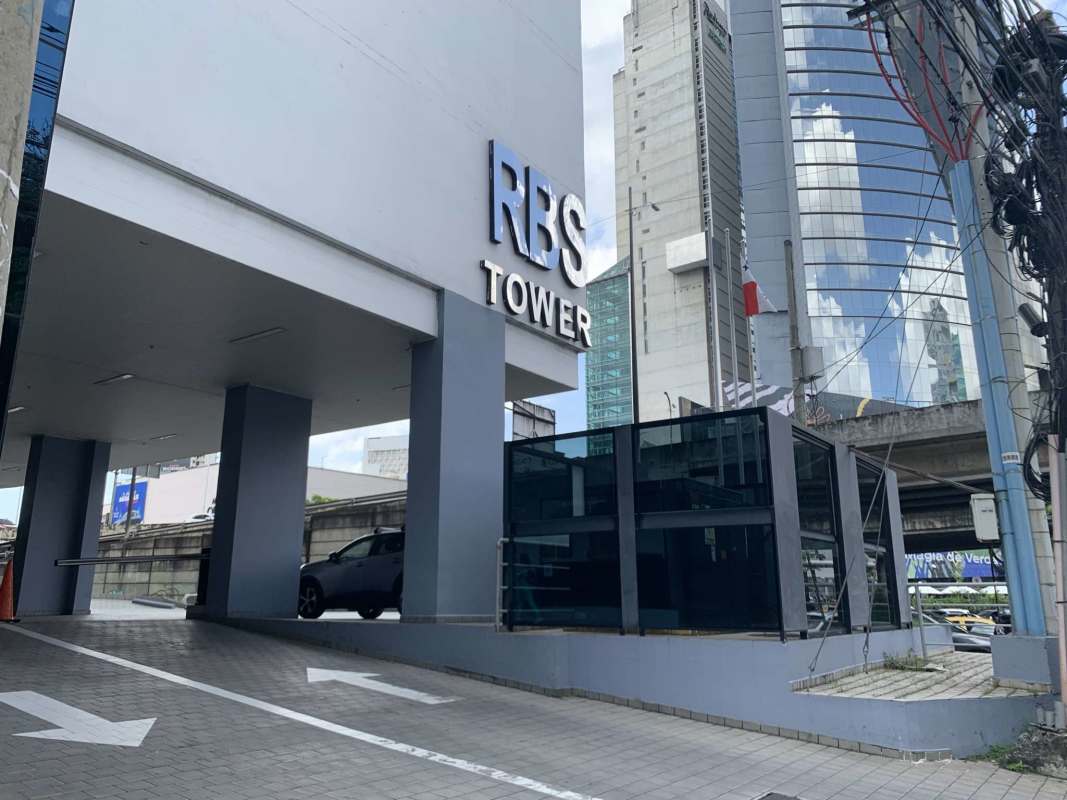 Modern commercial skyscraper RBS Tower exterior with surrounding urban skyline Panama City