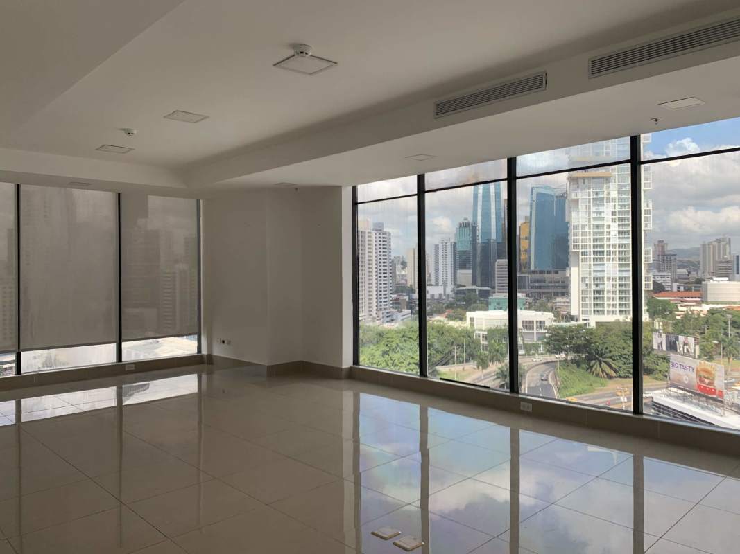Empty open-plan office space with panoramic city views floor-to-ceiling windows at RBS Tower Panama