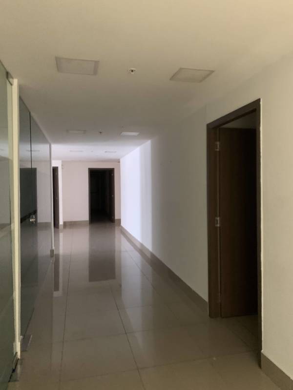 Modern glazed corridor inside office level at RBS Tower Punta Paitilla Panama City